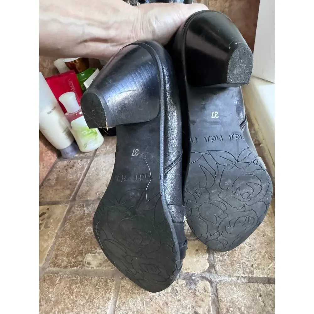 Black and silver low heel leather booties